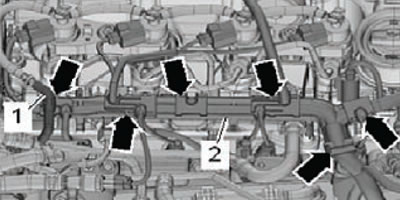 3. Open the fastening clamps (arrows), disconnect…