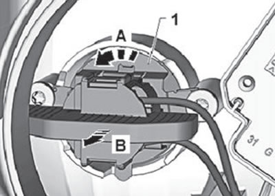 3. Pull the socket with the low beam lamp…