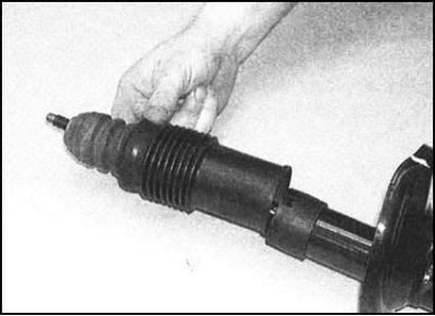 5. Снимите с поршневой сборки амортизатора…